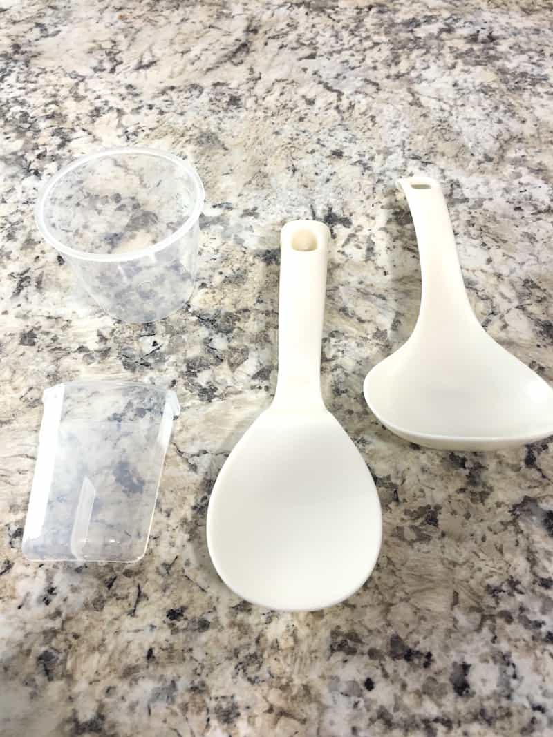 Instant pot utensils, measuring cup, and steam catcher.