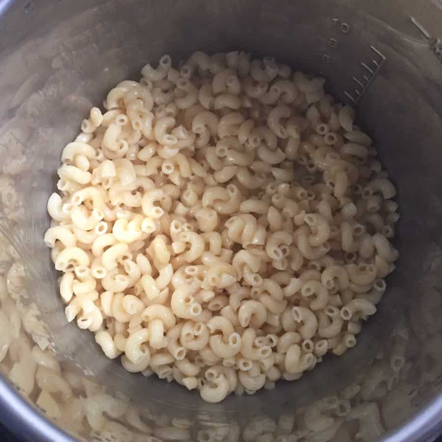 Cooked macaroni in pressure cooker pot.