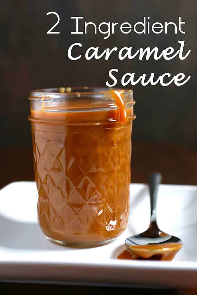 Caramel sauce in jar on a white plate. Spoon with caramel sauce sits next to the jar. Text on Image: 2 Ingredients Caramel Sauce.