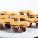 Nutter Butter cookie skateboards with Rolo wheels on marble serving plate.