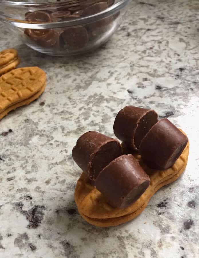 Nutter Butter Skateboards with four Rolo candies attached on a counter.