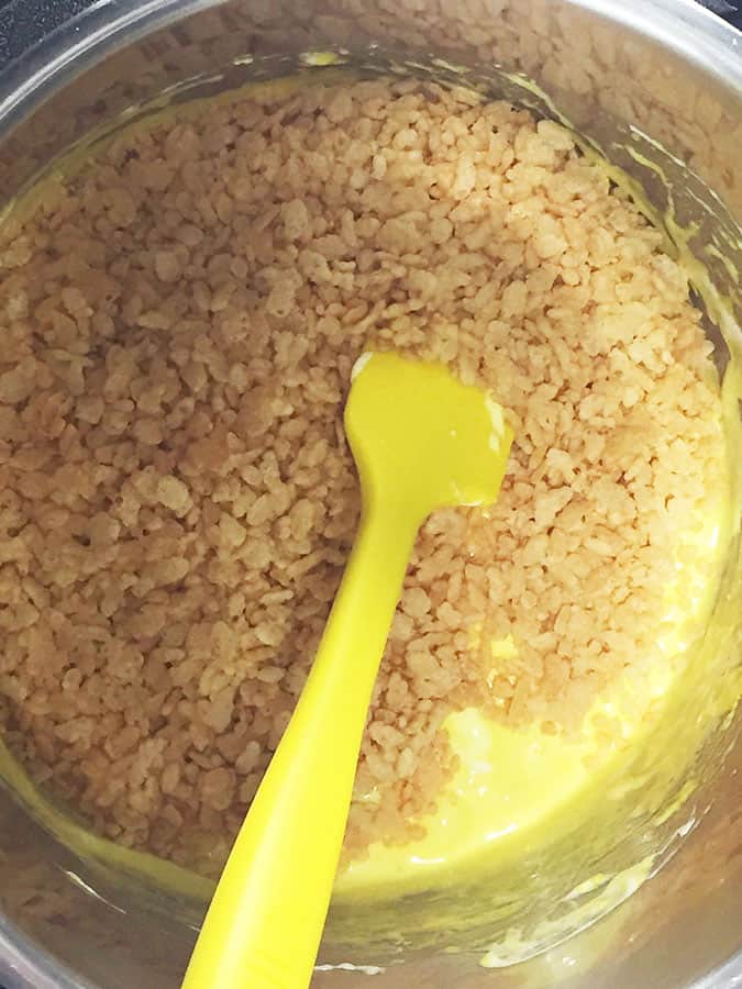 Crispy rice cereal added to melted Peeps in Instant Pot.