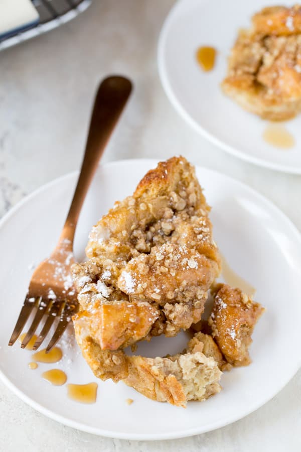 Plate of baked French toast with syrup.