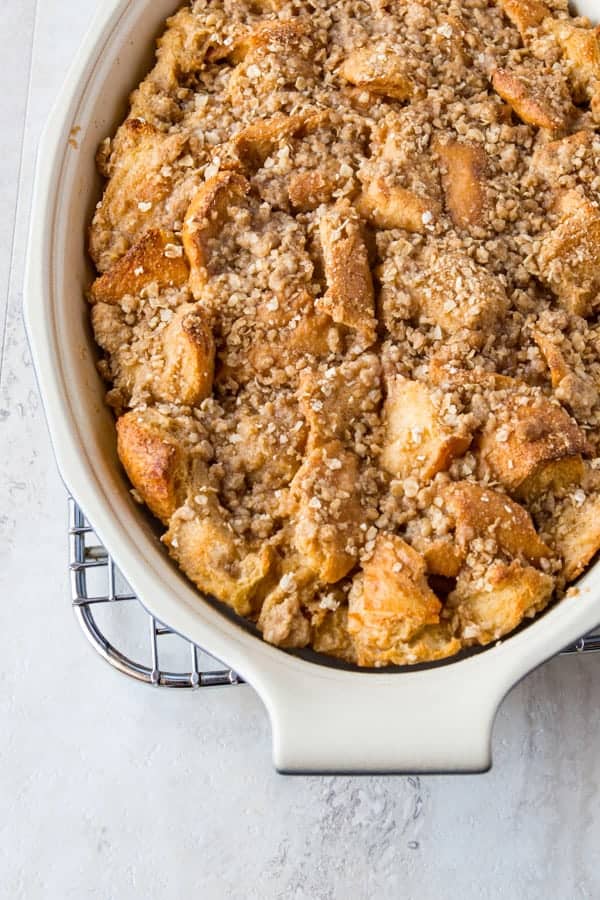 Dish of baked French toast topped with oat streusel. 