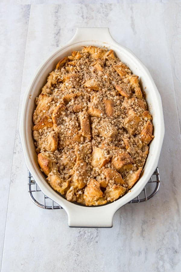 Dish of baked French toast topped with oat streusel. 