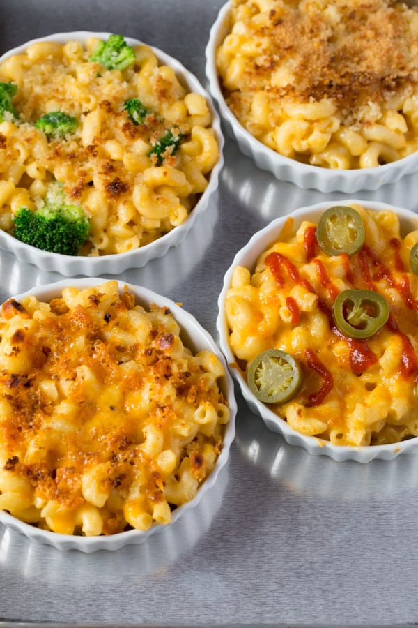 Four bowls of mac and cheese.