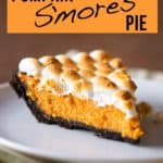 Slice of pumpkin pie topped with toasted marshmallows.