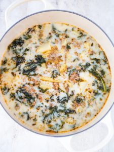 White pot of cooked zuppa toscana soup.