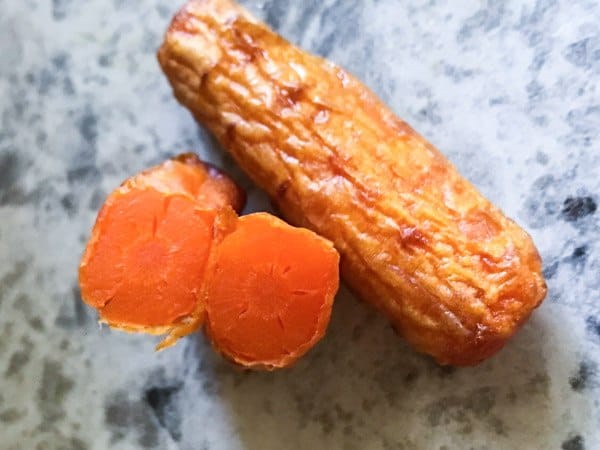 Cooked air fryer baby carrot cut in half. 