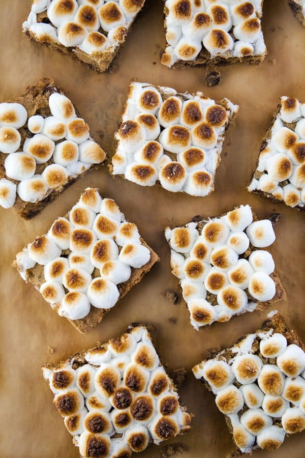 Cut Chocolate Chip Cookie Bars on Brown Parchment with Toasted Marshmallows