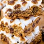 Stack of chocolate chip cookie bars topped with toasted mini marshmallows.