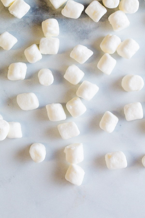 Mini marshmallows on a marble.