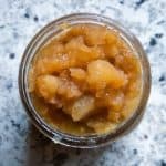 Overhead view of applesauce in small jar.