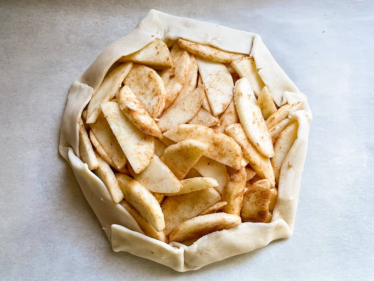 Apple galette on baking sheet.