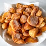 Cinnamon sugar biscuit donut holes on a plate.