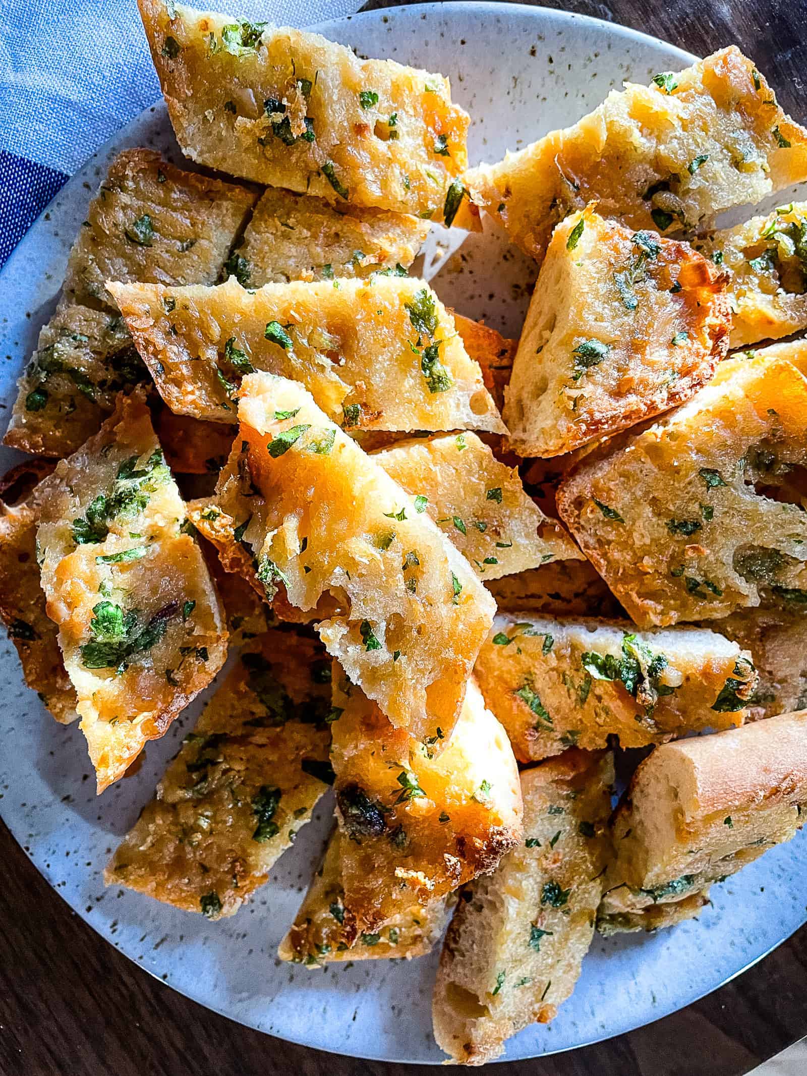 Roasted garlic bread slices on a plate