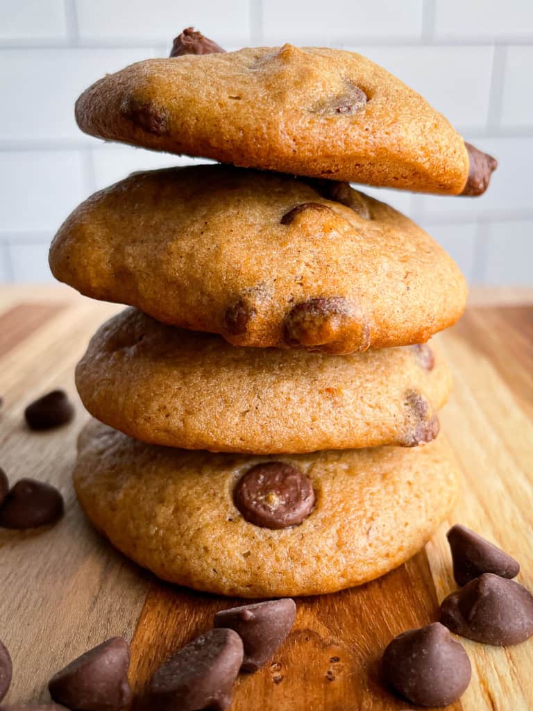 A stack of soft banana cookies with chocolate chips.