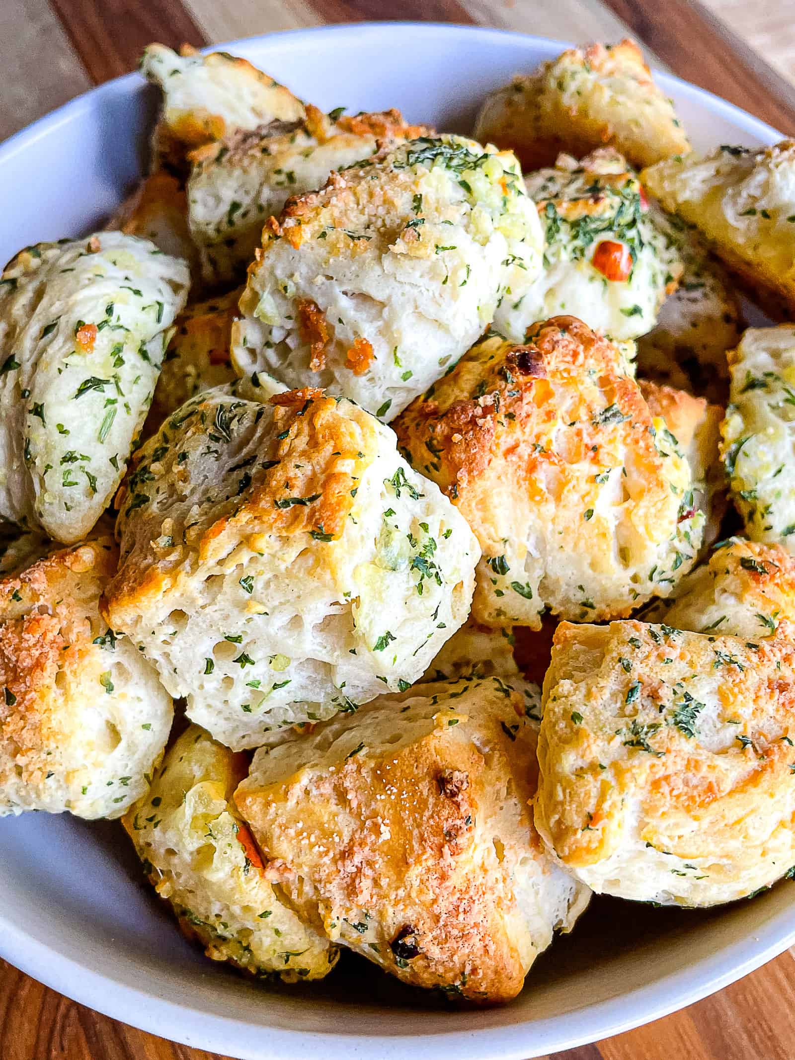 Garlic butter biscuit bites in a bowl.