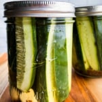 Refrigerator dill pickles in jar with lid.
