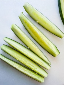 Cucumber sliced into spears.