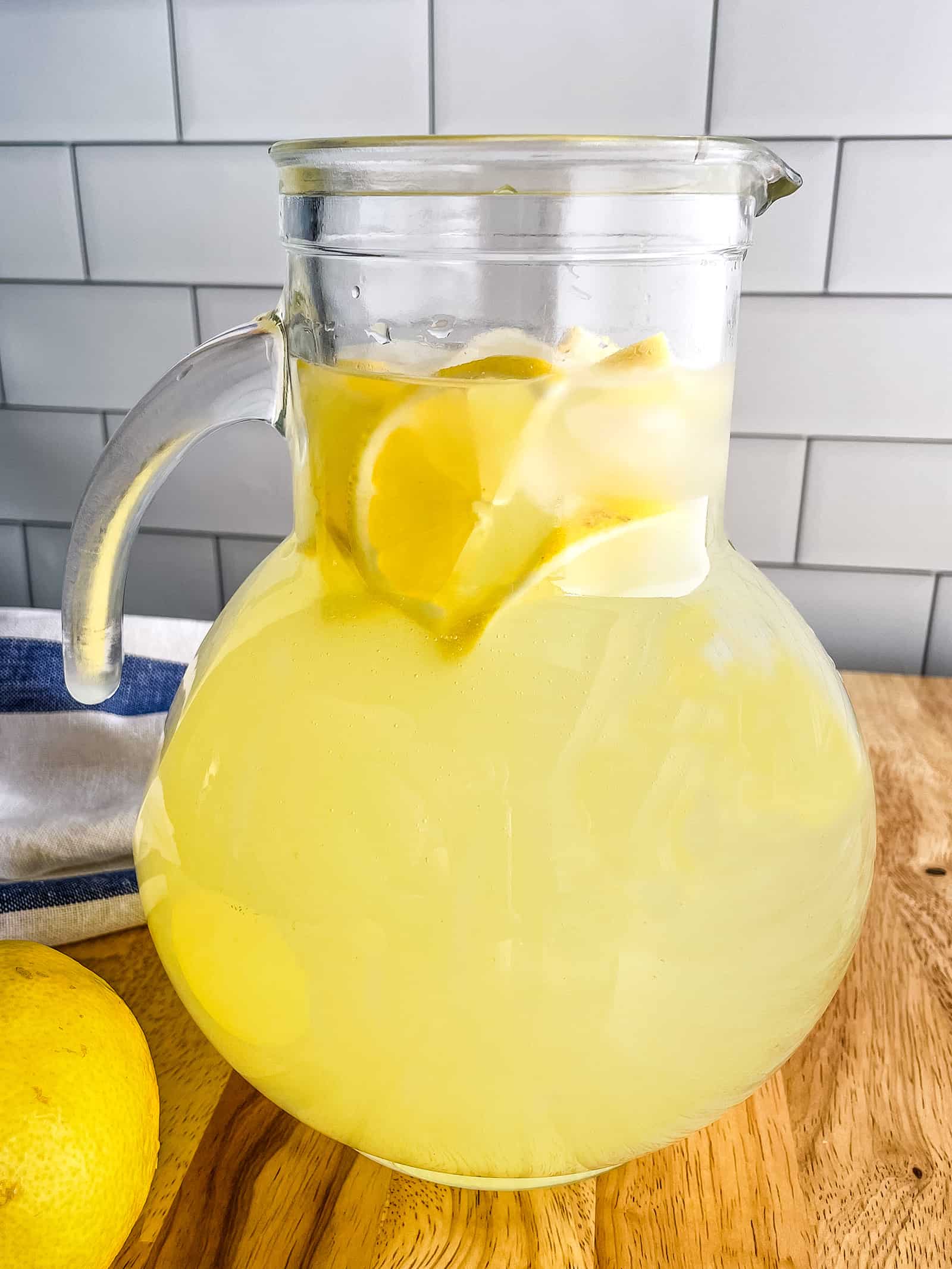 Homemade lemonade in a glass pitcher.