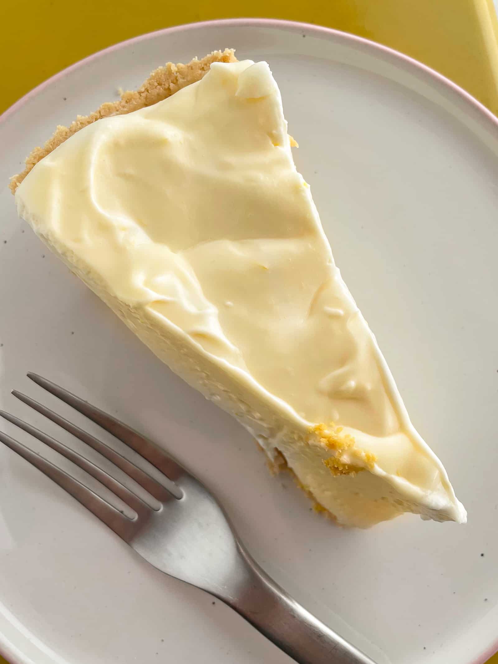 A slice of no-bake lemon pie on a plate.