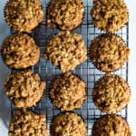 Zucchini crumb muffins on a cooling rack.