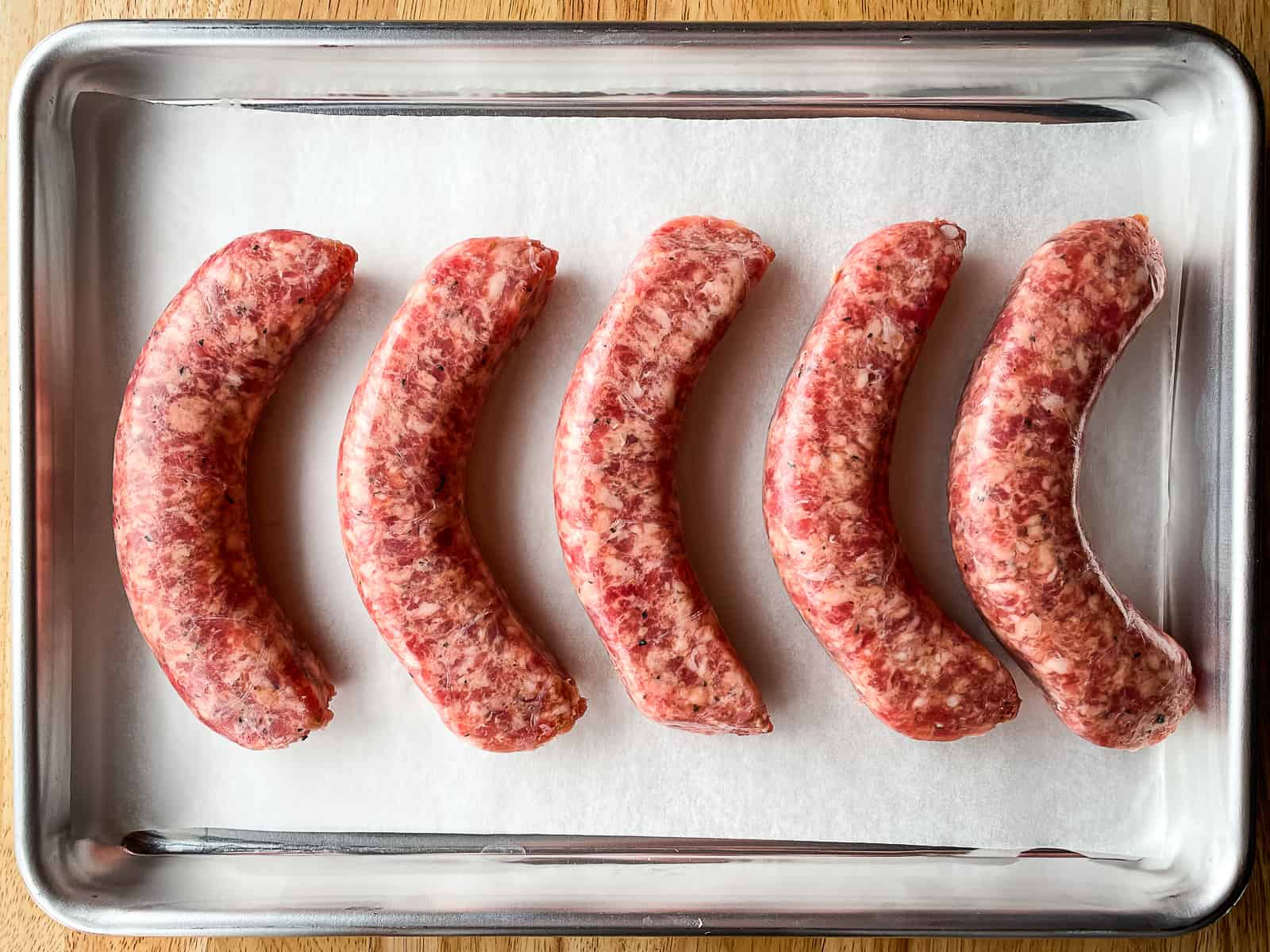 how long does it take to cook farmers sausage in the oven