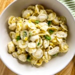 Jalapeño and corn pasta in a white bowl.