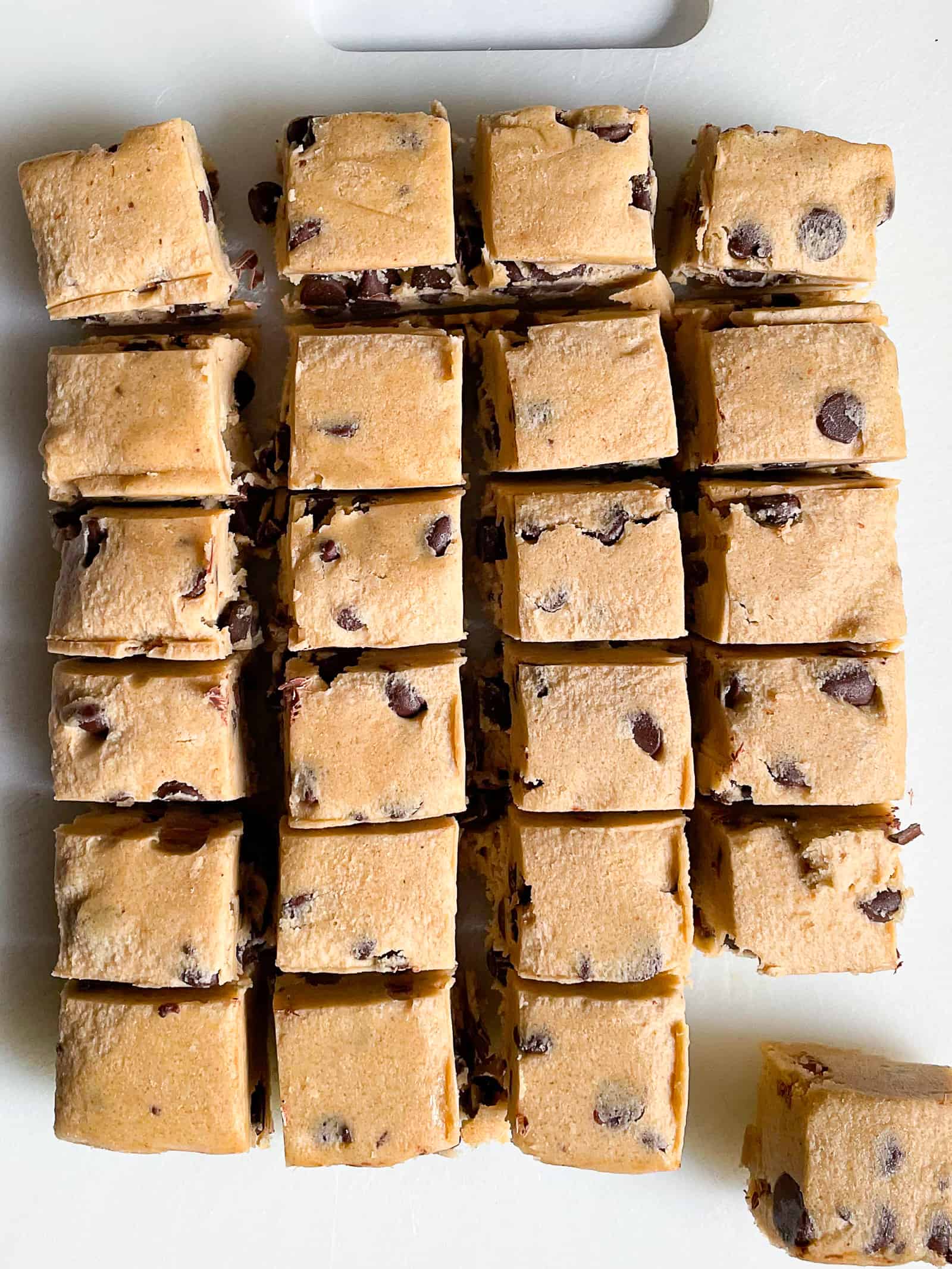 Chocolate chip cookie dough cut into squares.
