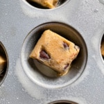 Square of chocolate chip cookie dough in a pan.