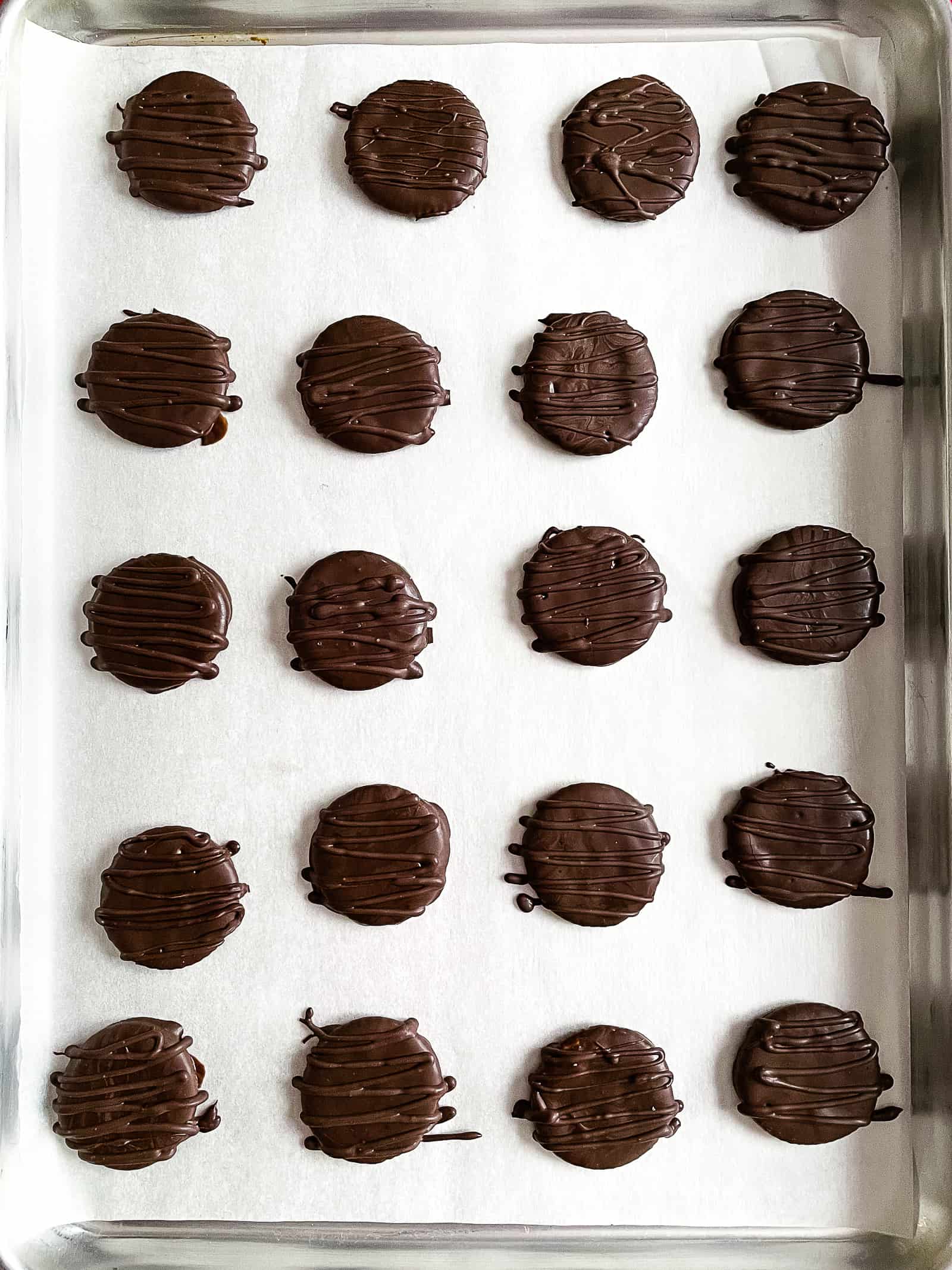 Pan of mint chocolate covered Ritz crackers on a pan.