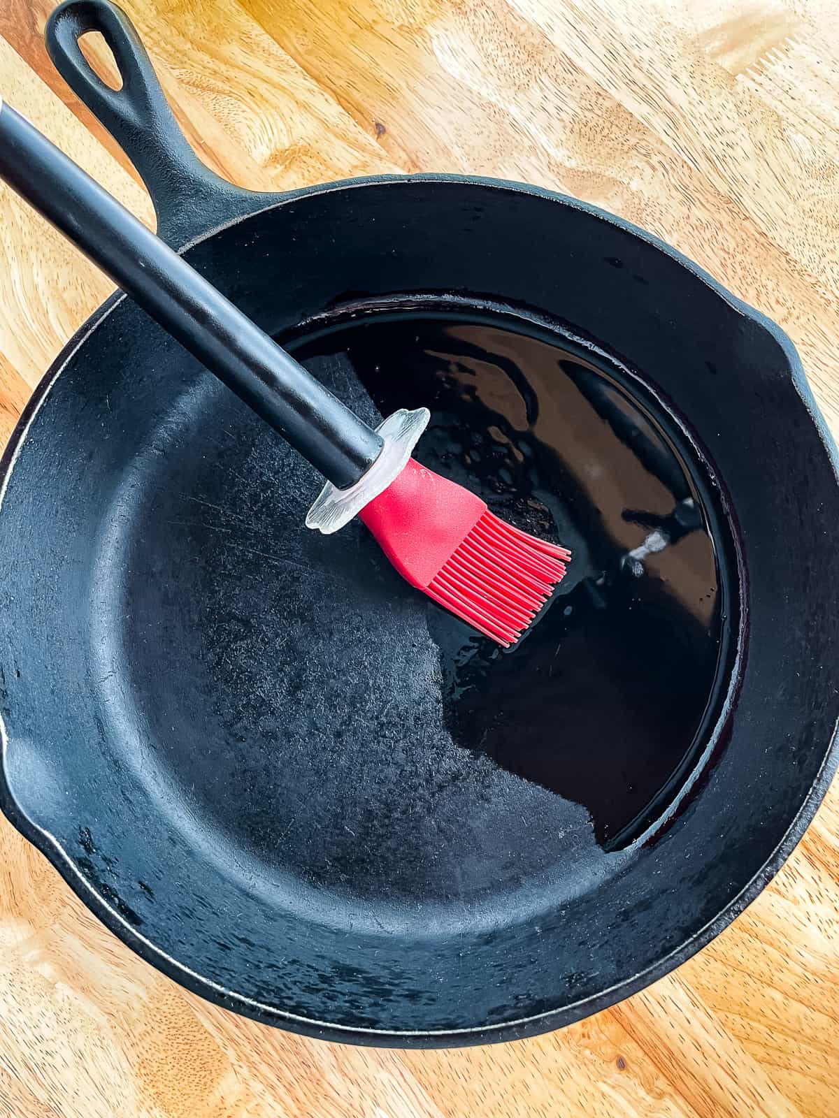 Oiling cast iron skillet.