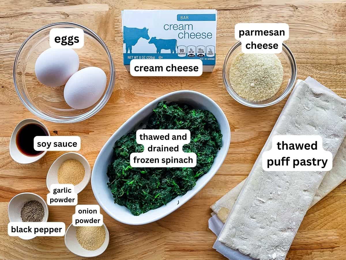 Ingredients for spinach puff pastry on the counter.