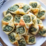 Baked spinach puff pastry on a plate.