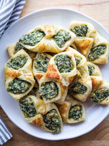 Baked spinach puff pastry on a plate.