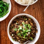 Korean BBQ-style ground beef bowl topped with sliced green onions.