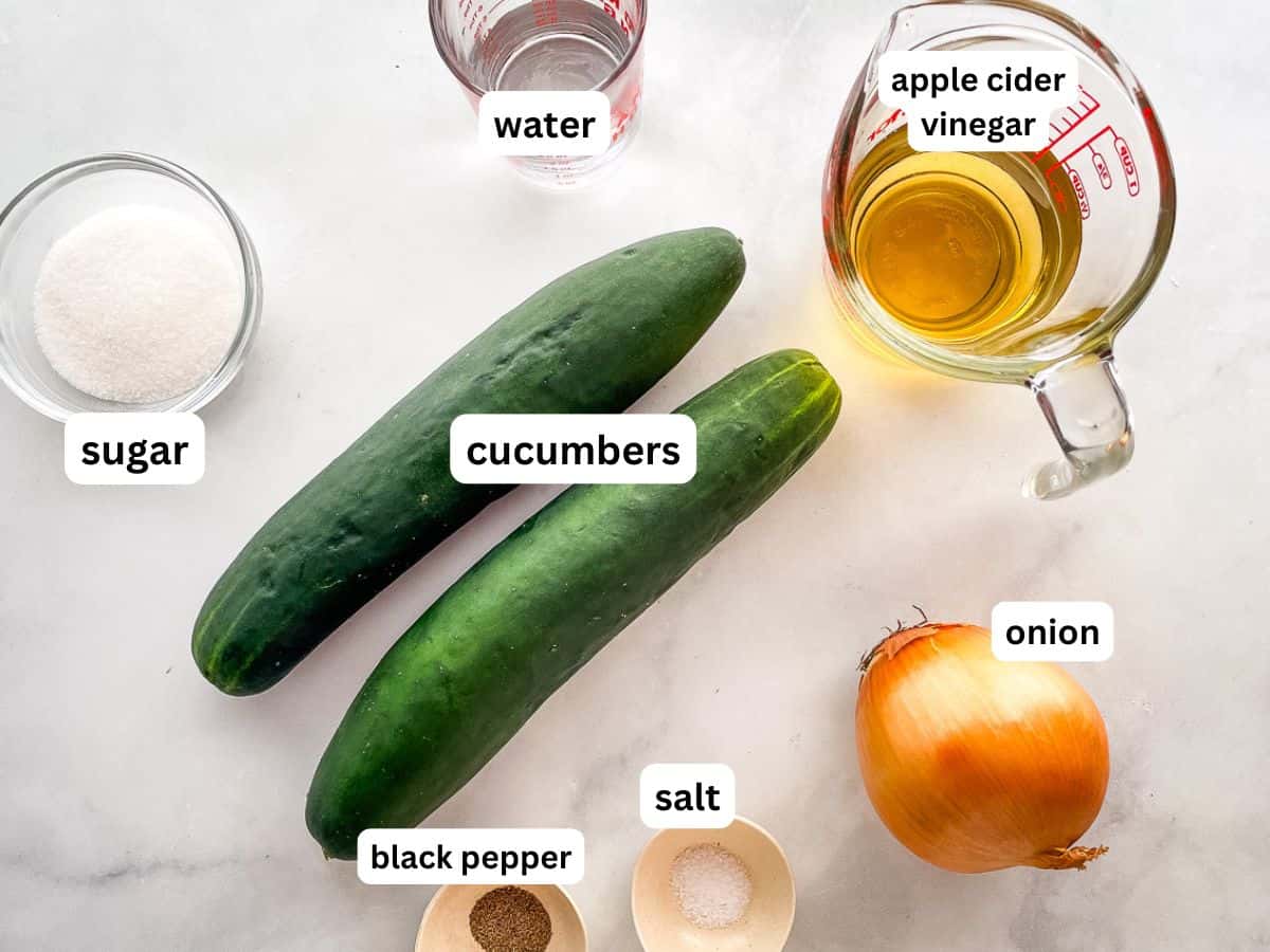 Ingredients for cucumber salad on the counter.