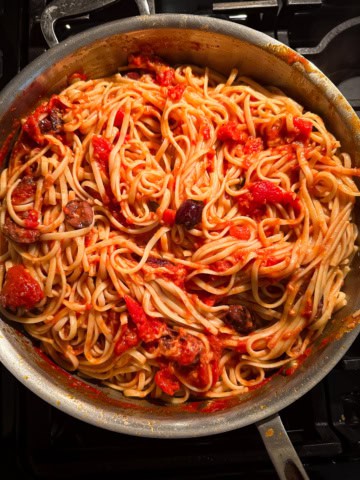 Pasta puttanesca in a pan.