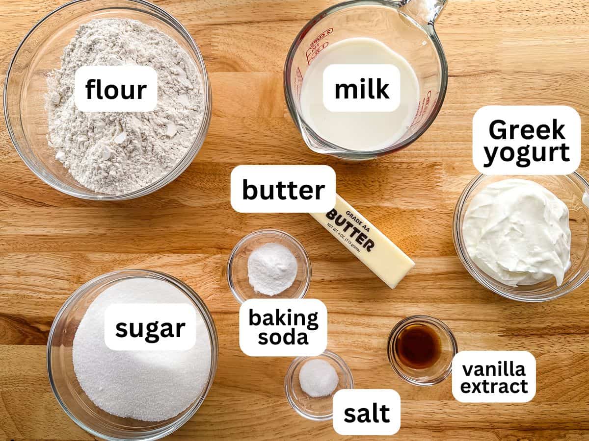 Ingredients for an eggless vanilla cake on the counter.