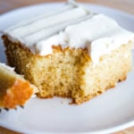 Slice of eggless vanilla cake on plate.