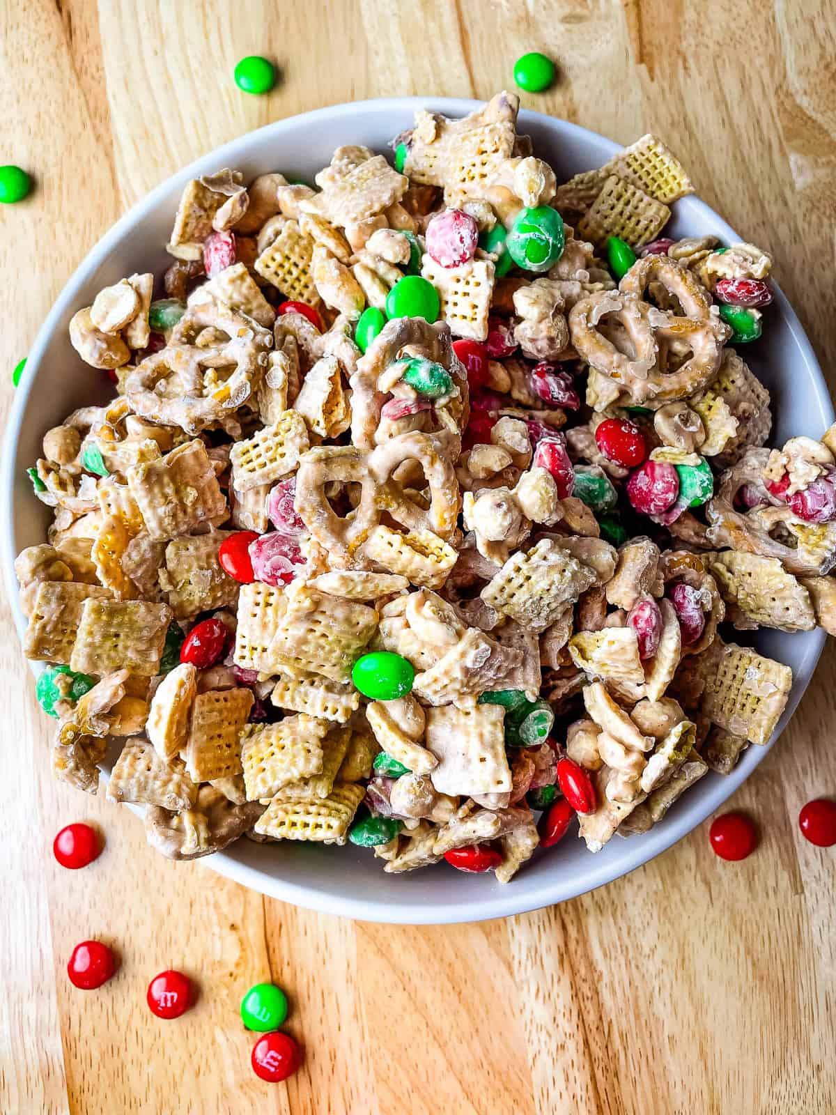 Bowl of Christmas Chex mix in a bowl.